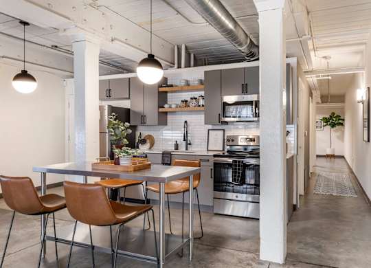 a kitchen and dining area in a loft at Highland Mill Lofts, Charlotte, North Carolina