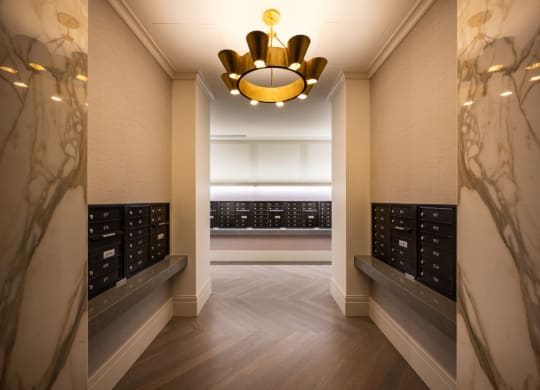 a long hallway with a chandelier and a row ofidges in a room  at The Belden Stratford, Chicago, IL