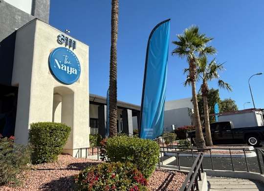 The sign on the building says "The Naya".