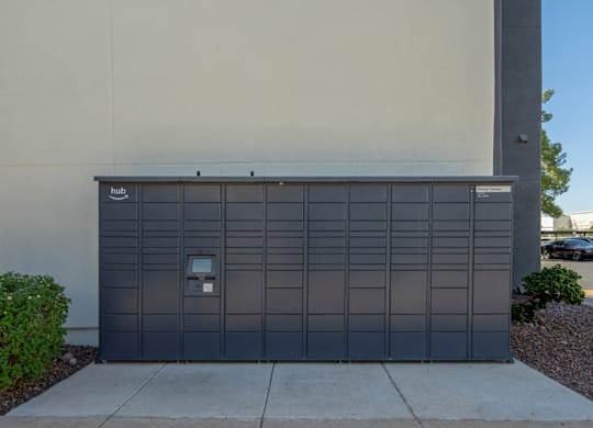 A large grey garage door with a small white sign on it.