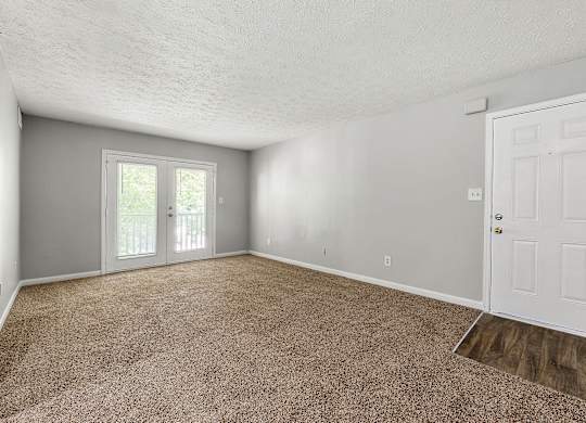 Apartment home living room at Bradford Gwinnett & Townhomes in Norcross, GA 30071
