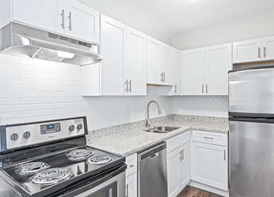 Upgraded kitchen with white cabinets at Georgian Oaks Apartments l & ll* Apartments, Georgia, 30080