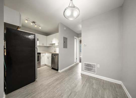 Kitchen with appliances and cabinets at Georgian Oaks Apartments l & ll* Apartments, Smyrna