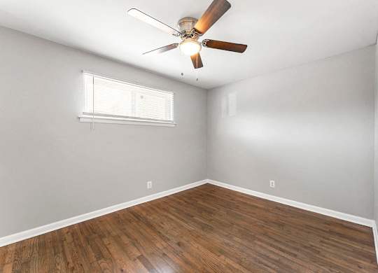 Wood-style Flooring with ceiling fan at Gardens at Washington Park, Atlanta, 30314