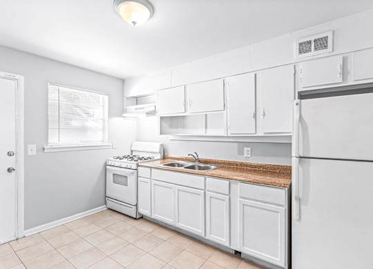 Fully Equipped Kitchen Includes Frost-Free Refrigerator, Electric Range, & Dishwasher at Gardens at Washington Park, Atlanta, Georgia