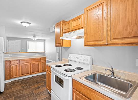 Kitchen with wooden closet at Gardens at Washington Park, Georgia