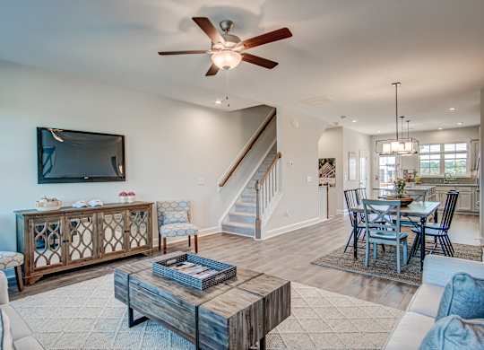 the living room and dining room are open to the kitchen and great room