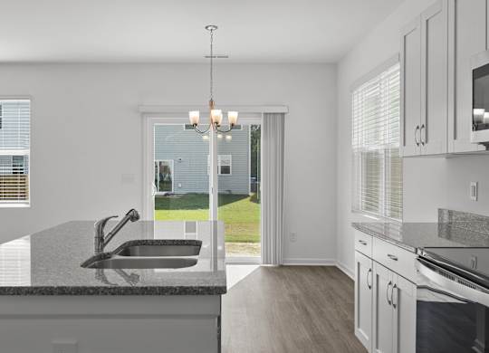 a kitchen with a sink and a window