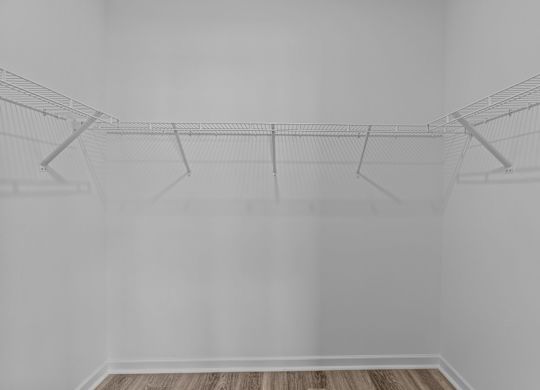 A wire sculpture of a bird is suspended from the ceiling.