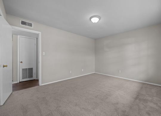 A room with a door and a window.