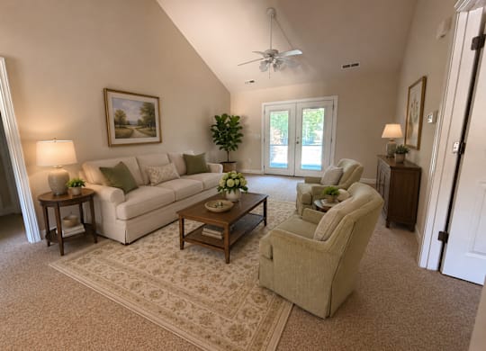 A living room with a couch, chair, and table.