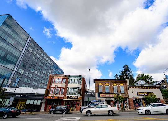 a view of a city street with cars and buildings