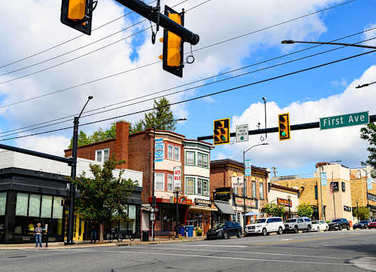 a city street with traffic lights and buildings