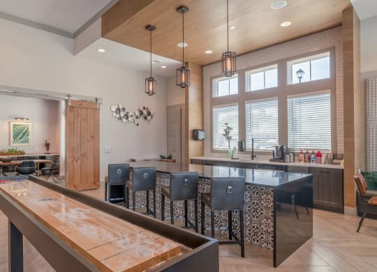 a large kitchen with a bar and a dining table at Carmel Vista, McDonough