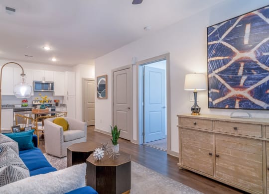 a living room and kitchen with a blue door at Carmel Vista, McDonough, GA, 30253