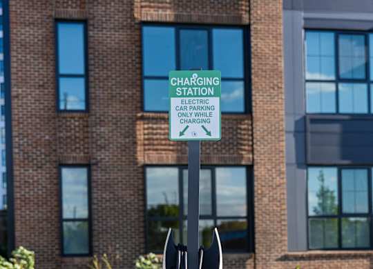a pair of parking meters in front of a building
