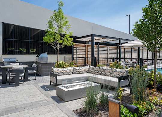 a courtyard with a fountain and tables and chairs