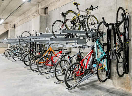 a rack full of bikes in a parking garage