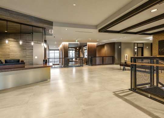 the lobby of a hotel with a reception desk