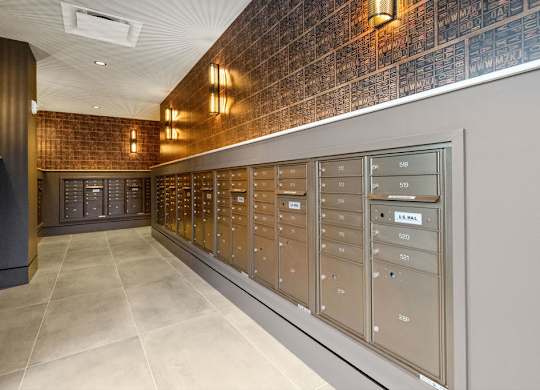the mail room in the building is full of mailboxes