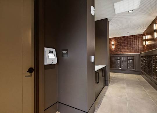 a view of a hallway with a door to a wine cellar