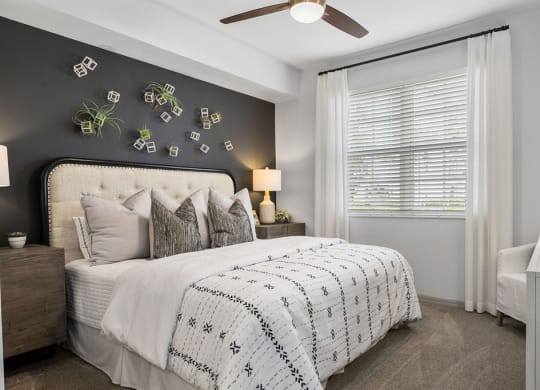 a bedroom with a bed and a ceiling fan at Inspira, Florida