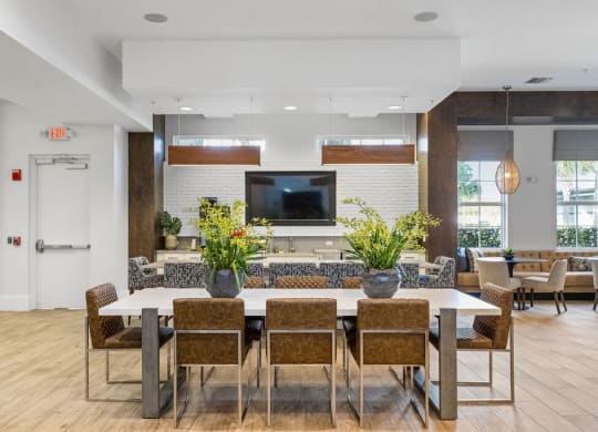 Large dining table for resident to gather, work from, eat and visit at Inspira, Naples, FL, 34113