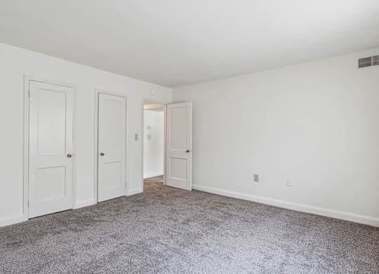 Senior-friendly bedroom at Park View at Towson with two doors and natural light