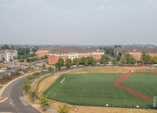 a baseball field in front of a building
