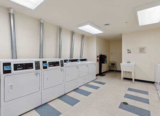 a room filled with washers and dryers