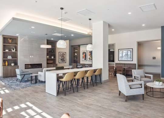 A modern living room with a fireplace and a dining area.