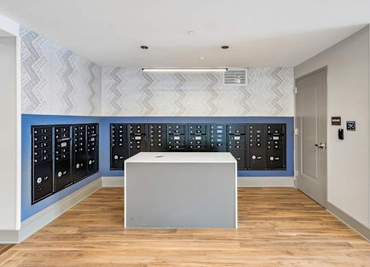 A white box sits in front of a wall of black switches.