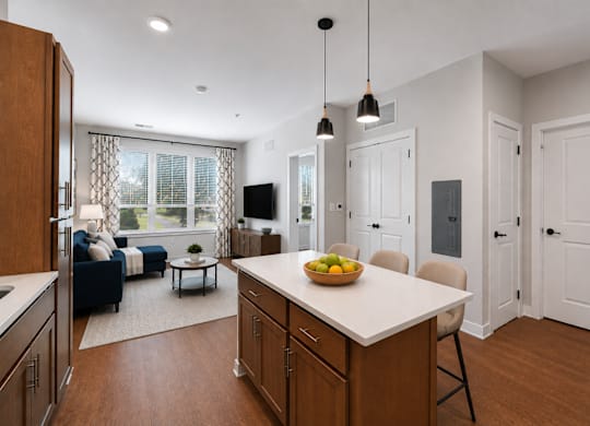 A kitchen with a table and chairs in the middle of the room.