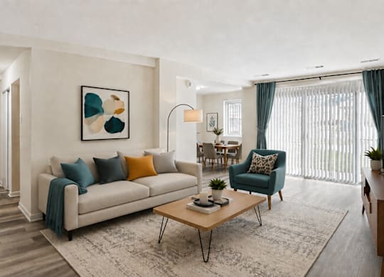 A living room with a couch, armchair, and coffee table.