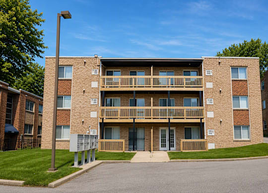 A large brick building with a balcony on the second floor.
