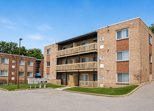 A large brick building with a balcony on the second floor.