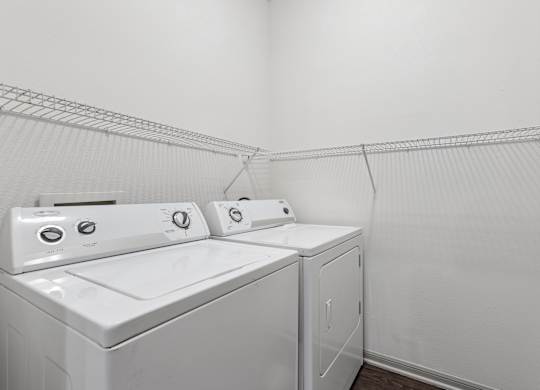 A laundry room with a washer and dryer.