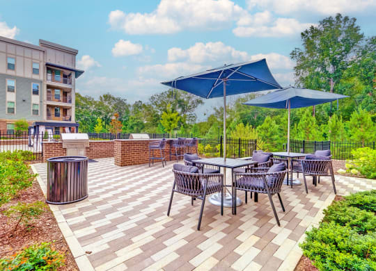 the reserve at bucklin hill patio with tables and umbrellas