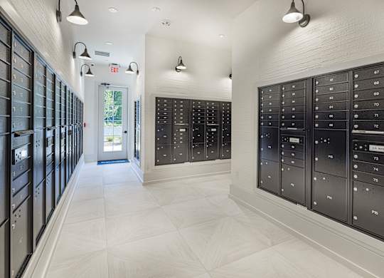 A long hallway with mailboxes on the wall at Folksong Apartments, Georgia