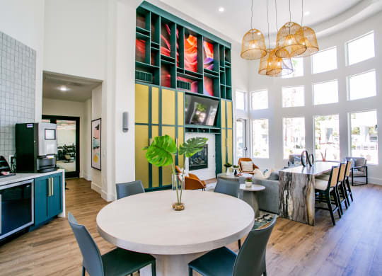 Octave Apartments clubhouse table and living room at Octave Apartments, Las Vegas, NV, 89123