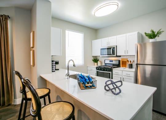 Octave Apartments Kitchen with stainless steel appliances at Octave Apartments, Nevada