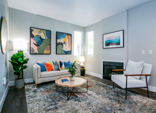 Octave Apartments a living room with gray walls and a fireplace at Octave Apartments, Nevada, 89123