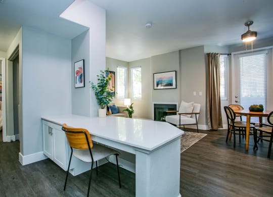 Octave Apartments a kitchen and living room with a table and chairs at Octave Apartments, Nevada, 89123