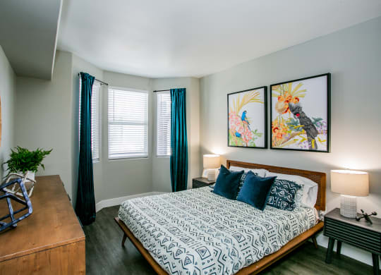 Octave Apartments a bedroom with a bed and two paintings on the wall at Octave Apartments, Nevada, 89123