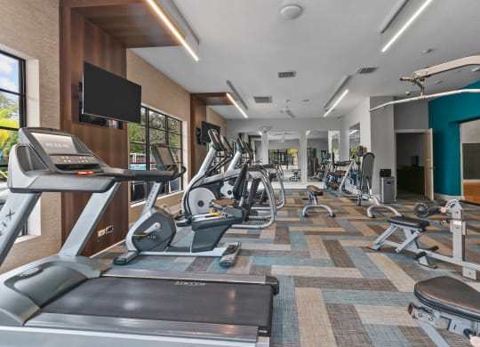 The Preserve at Westchase Apartments fitness center with cardio machines