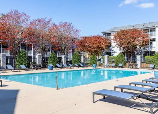 Indigo Apartments Pool with Lounge Chairs