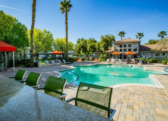 Octave Apartments in Las Vegas, Nevada Clubhouse Exterior and Large Pool with Lounge Chairs at Octave Apartments, Las Vegas