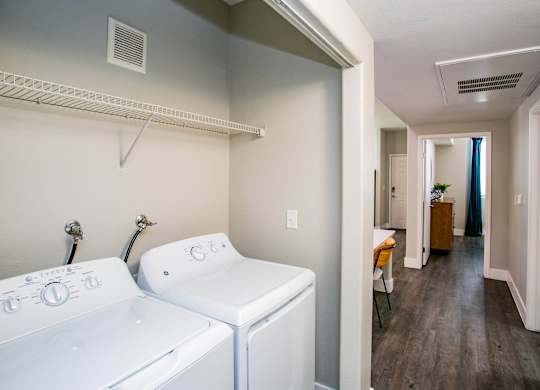 A laundry room with a washer and dryer. at Octave Apartments, Las Vegas