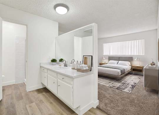 Primary bedroom with ensuite vanity and modern finishes at Parc @ 5 Apartments, Downey, 90240