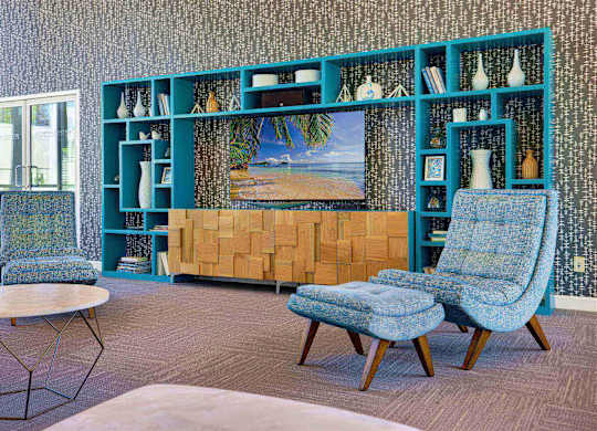 Entertainment center with shelving and lounge seating at Parc @ 5 Apartments, California